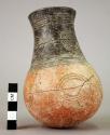 Small pottery jar - Red Polished I Ware. Incised linear designs of circles &  st
