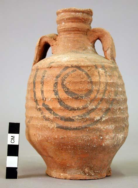 Two handled jug of hard red ware, black painted decoration