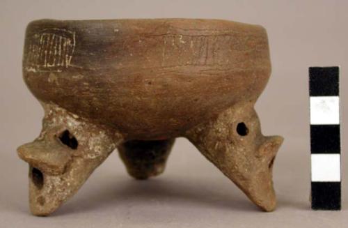 Tripod vessel, incised decoration