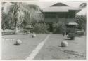 House with stone balls in yard