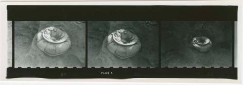 Contact print of negative: three photographs of cache