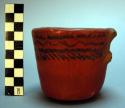 Pottery cup, red and black