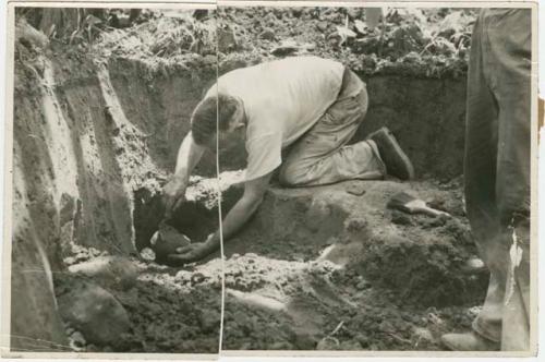 Samuel K. Lothrop excavating stone balls