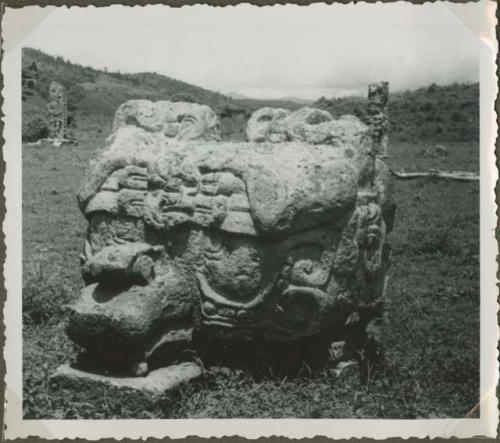 Large stone sculpture in an open field