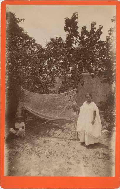 Woman and boy making a hammock