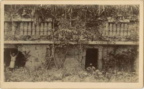 Facade of Edifice 2 with two local men