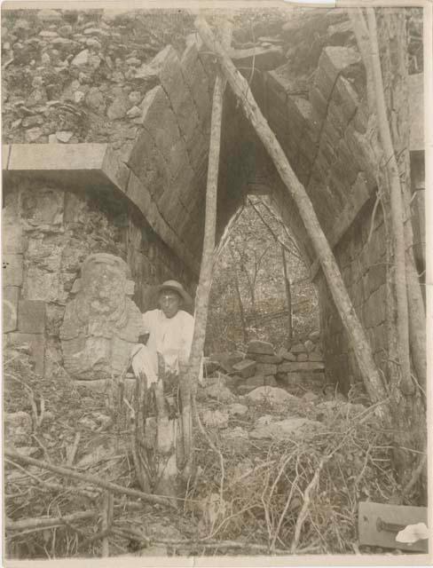 Vaulted archway with local man and statue