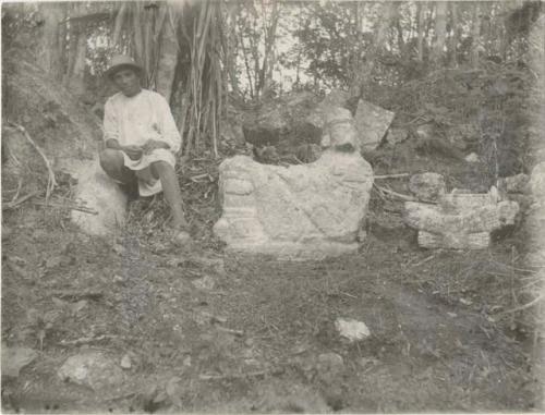 Stone sculptures on hill with local man