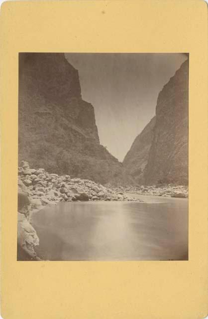 River with rocky banks running through a canyon