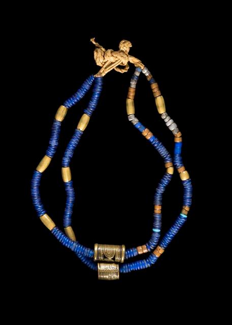 Necklace of glass, brass, and white metal beads