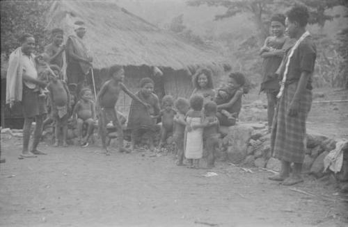 Elders watch Padafan and other children play at lego-lego, a traditional circle dance