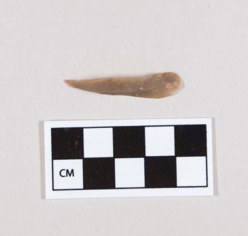 Flint bladelet; retouched point; tan-colored stone