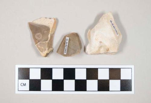 Flint flakes, includes tan, grey and cream colored stone, some contain cortex