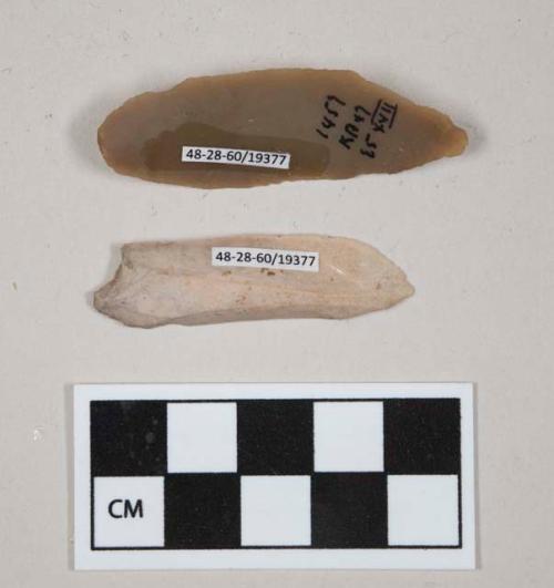 Flint pointed blades; cream and brown colored stone