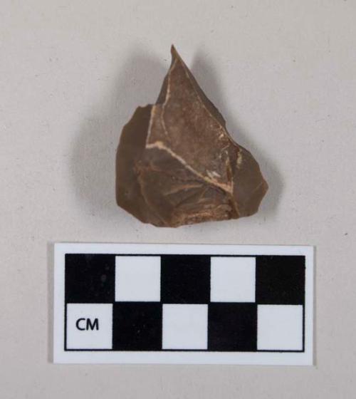 Chipped stone, flint flake, with evidence of use or retouching