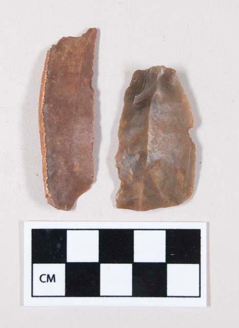 Chipped stone, flint blades, each with notch, one with cortex