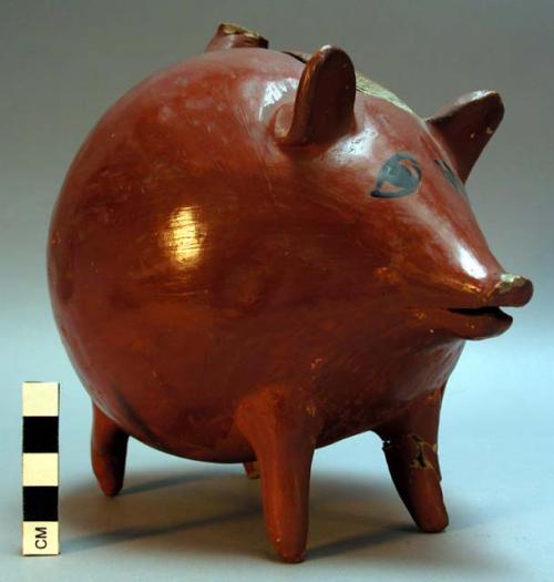 Pottery pig with coin slot (piggy bank)