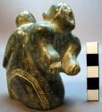 Kneeling female figure with child of green serpentine