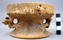Pedestalled pottery bowl with animal-shape adornos