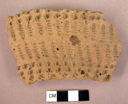 Potsherd-pit and comb ornamented