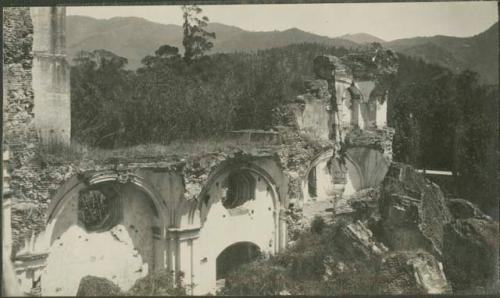 Antigua, building ruins with view of mountains in background