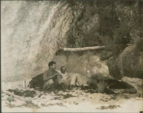 Sylvanus Griswold Morley, Samuel Kirkland Lothrop, and unknown man eating in the sand in Tulum