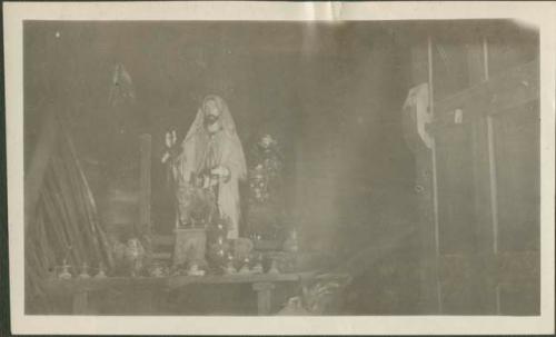 Decorated table with religious artifacts, possibly Chichicastenango