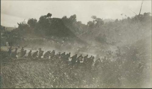 Near Solola, dragging a log for a bridge