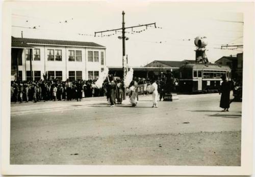 Cherry blossom festival parade in front of railroad station