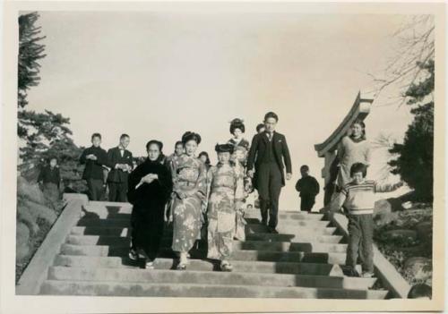 Wedding party, with bride in last row