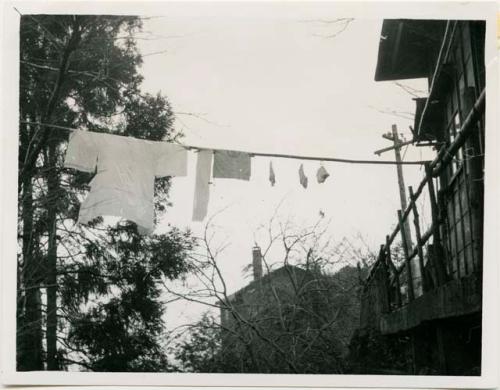 Laundry drying on line next to house