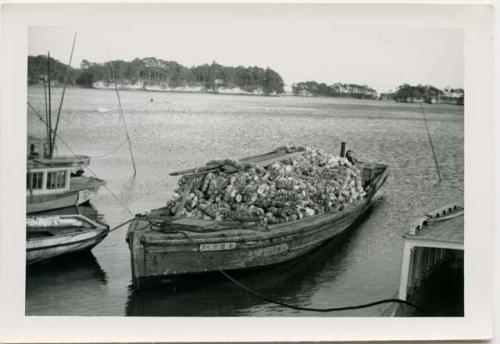 Boat with load of oyster shells