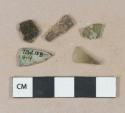 Olive green vessel glass fragments, likely body fragments