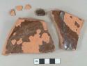 Brown lead glazed redware vessel base and body fragments