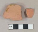 Redware vessel body fragments, 1 fragment with light brown lead glaze