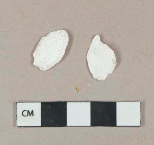 White undecorated shell fragments, heavily degraded