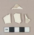 Undecorated creamware vessel body fragment, white paste
