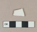 Undecorated white salt glazed stoneware vessel body fragment