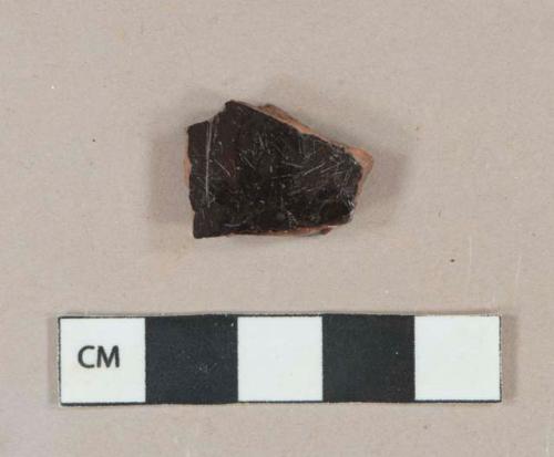 Black lead glazed redware vessel body fragment, likely jackfield type