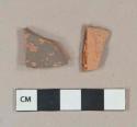 Unglazed redware vessel body fragments, 1 painted brown