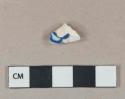 Blue on white handpainted pearlware vessel body fragment, white paste