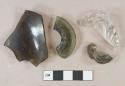3 dark olive glass fragments, 1 body fragment, 2 flared bottle finishes; 1 colorless molded glass base fragment