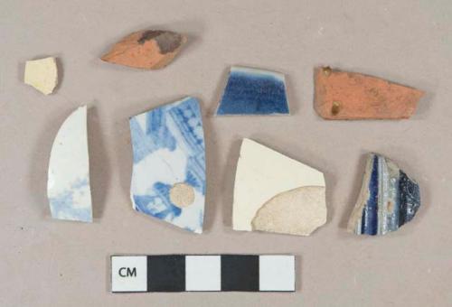 2 blue on white transferprinted earthenware vessel body fragments, white paste; 2 undecorated creamware vessel body fragments, light buff paste; 1 dark blue handpainted porcelain vessel rim fragment, white paste; 1 gray salt-glazed stoneware vessel body fragment, cobalt blue decoration, gray paste; 2 brown lead glazed redware vessel body fragments