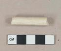 White undecorated kaolin pipe stem fragment, 5/64" bore diameter