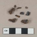 Ferrous metal nail fragments, possibly nails, heavily corroded