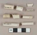 White undecorated kaolin pipe stem and bowl fragments, 1 stem with 4/64" bore diameter, 6 stems with 6/64" bore diameter, 1 stem with 7/64" bore diameter