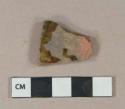 Mottled brown lead glazed redware vessel body fragment, irregularly fired