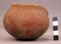 Small reddish-gray pottery bowl - coarse tempered, both handles missing