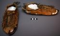 Pair of old moccasins. Bootie style with fringes. Rawhide soles.