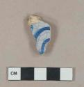 Blue on white handpainted tin-glazed earthenware vessel body fragment, buff paste